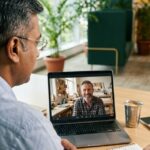 Vimansoft consultant planning a website project with a UK business owner on a video call